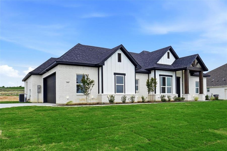 Front exterior of a new home in , Springtown, TX, highlighting curb appeal (Image 27).
