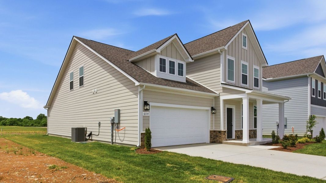 Home Exterior with two types of siding and two car garage Home Exterior with two types of siding and two car garage