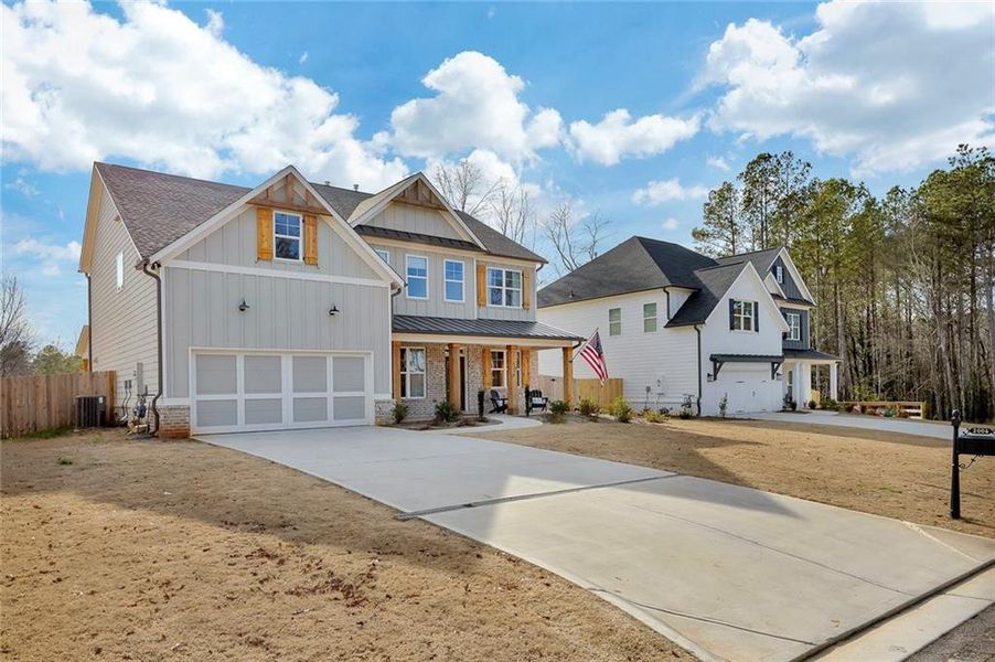 Front exterior of a new home in , Marietta, GA, highlighting curb appeal (Image 27).