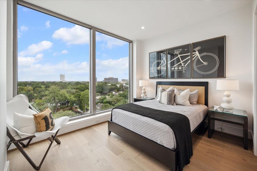 Private En-suite guest bedroom with touch of a button motorized window shades, amazing tree top views and walk-in closet, all designed for your guest ultimate comfort and convenience. Photo of another unit with same layout