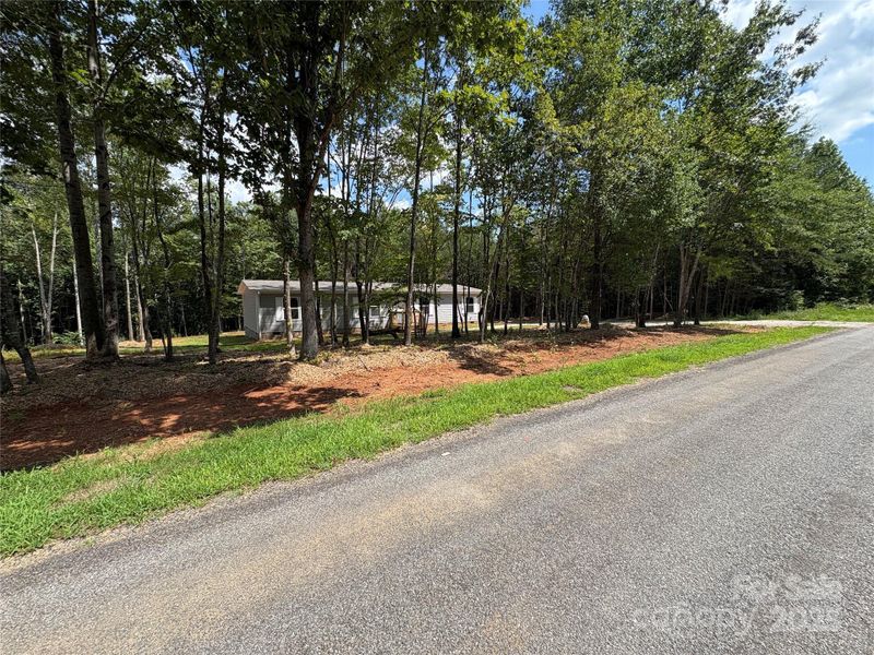 Front exterior of a new home in , Yadkinville, NC, highlighting curb appeal (Image 9).