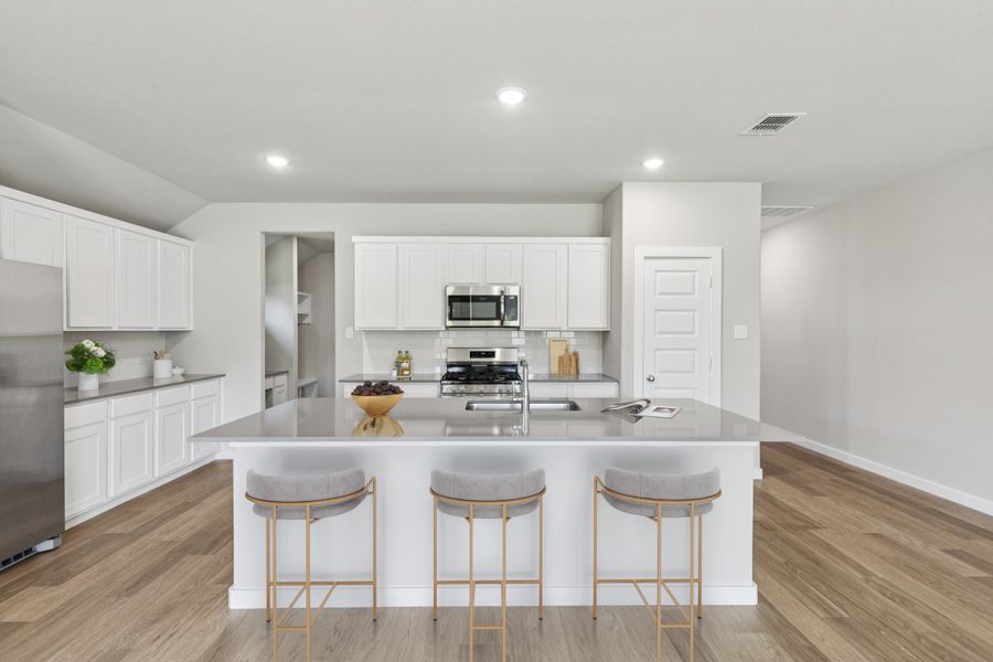 Kitchen in the Heisman home plan by Trophy Signature Homes – REPRESENTATIVE PHOTO Kitchen in the Heisman home plan by Trophy Signature Homes – REPRESENTATIVE PHOTO