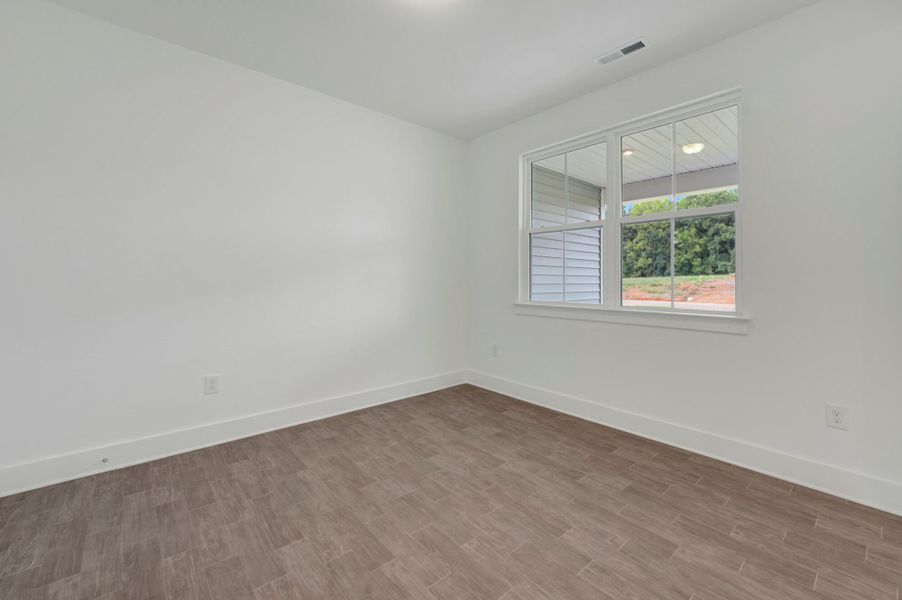 Spacious, unfurnished interior of a new home in McAlister Creek, Clayton (Image 14).
