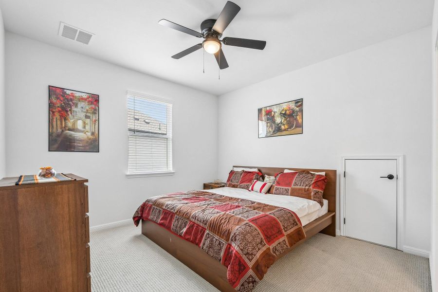 A restful chamber showcasing a broad window and a welcoming color palette.