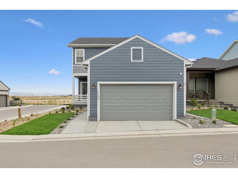 Front exterior of a new home in Kinston Cottage, Loveland, CO, highlighting curb appeal (Image 26).