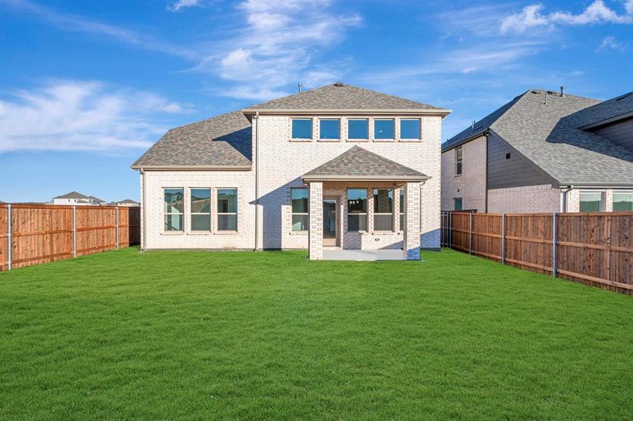 Exterior details and patio area of a home in Lily Creek at Sutton Fields, Aubrey (Image 24).
