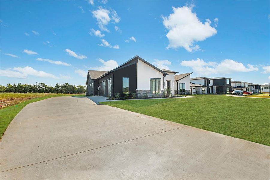Front exterior of a new home in , Red Oak, TX, highlighting curb appeal (Image 1). Front exterior of a new home in , Red Oak, TX, highlighting curb appeal (Image 1).