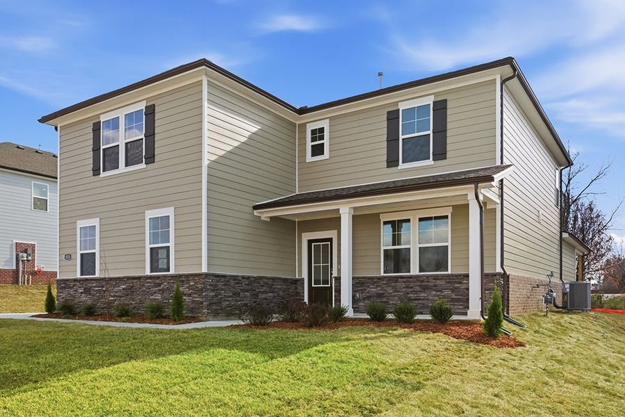 A house with a lawn in front. A house with a lawn in front.