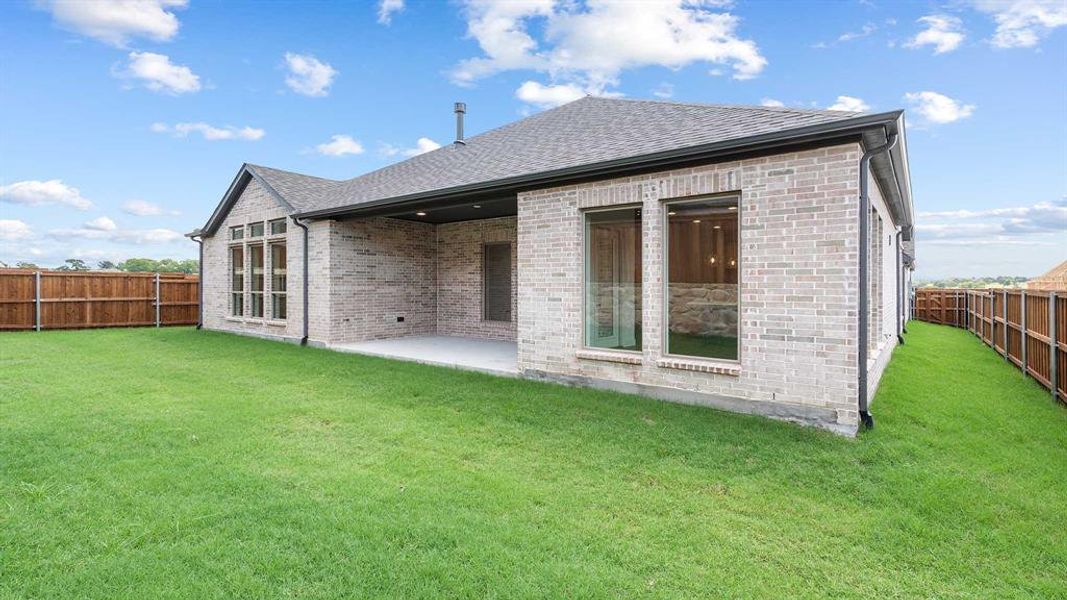 Front exterior of a new home in Terraces 62', Rockwall, TX, highlighting curb appeal (Image 1). Front exterior of a new home in Terraces 62', Rockwall, TX, highlighting curb appeal (Image 1).