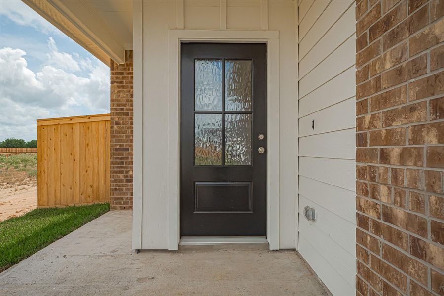 Exterior details and patio area of a home in La Segarra, Brookshire (Image 23).