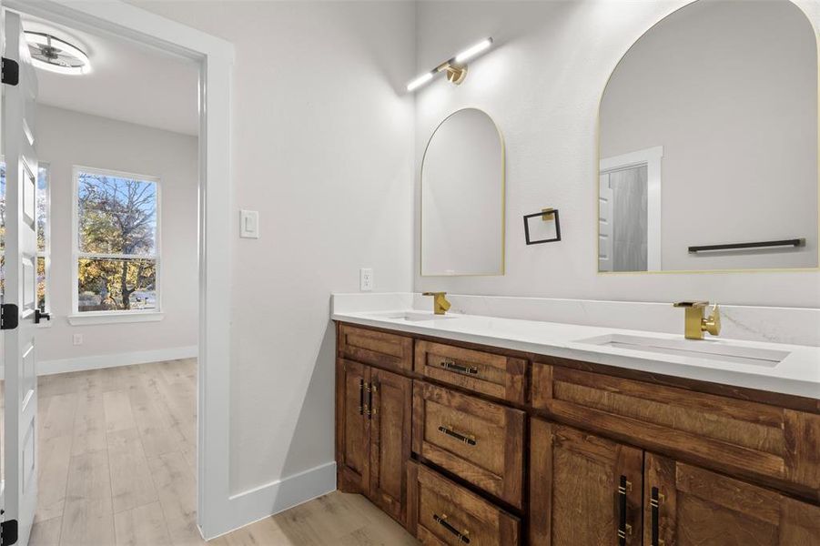 Bathroom with hardwood / wood-style floors and vanity