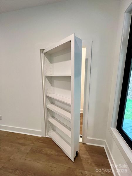 Bookshelf opens for additional storage Bookshelf opens for additional storage