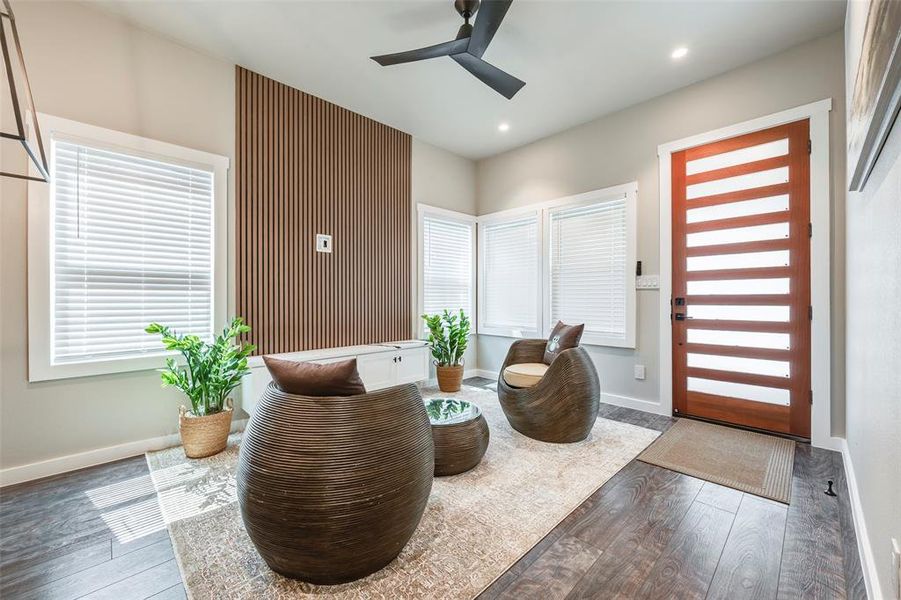 Entrance foyer featuring plenty of natural light, hardwood / wood-style flooring, ceiling fan, and recessed lighting