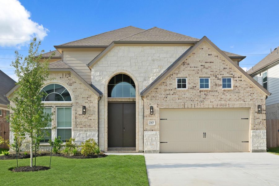 Front exterior of a new home in Morton Creek Ranch, Katy, TX, highlighting curb appeal (Image 1). Front exterior of a new home in Morton Creek Ranch, Katy, TX, highlighting curb appeal (Image 1).