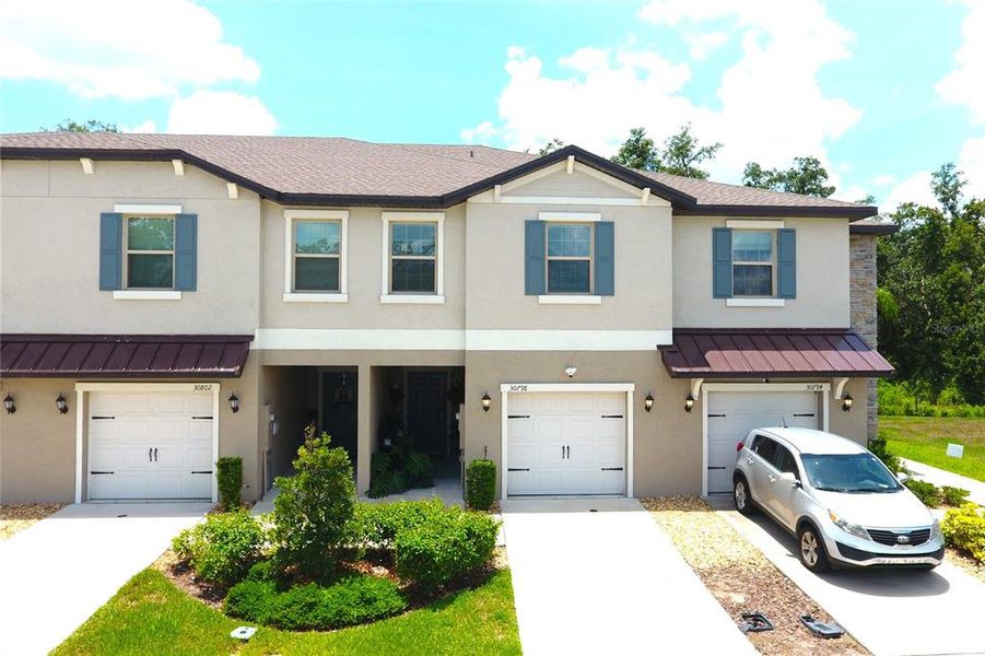 Front exterior of a new home in , Wesley Chapel, FL, highlighting curb appeal (Image 2). Front exterior of a new home in , Wesley Chapel, FL, highlighting curb appeal (Image 2).