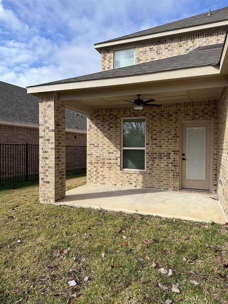 The covered back porch provides a space for you to enjoy your patio furniture with a beautiful view of the lake.