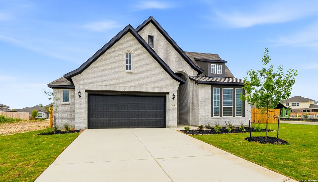 Front exterior of a new home in Alsatian Oaks, Castroville, TX, highlighting curb appeal (Image 26).