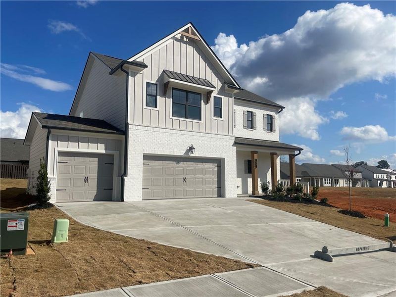 Front exterior of a new home in Summerlin, Winder, GA, highlighting curb appeal (Image 2).
