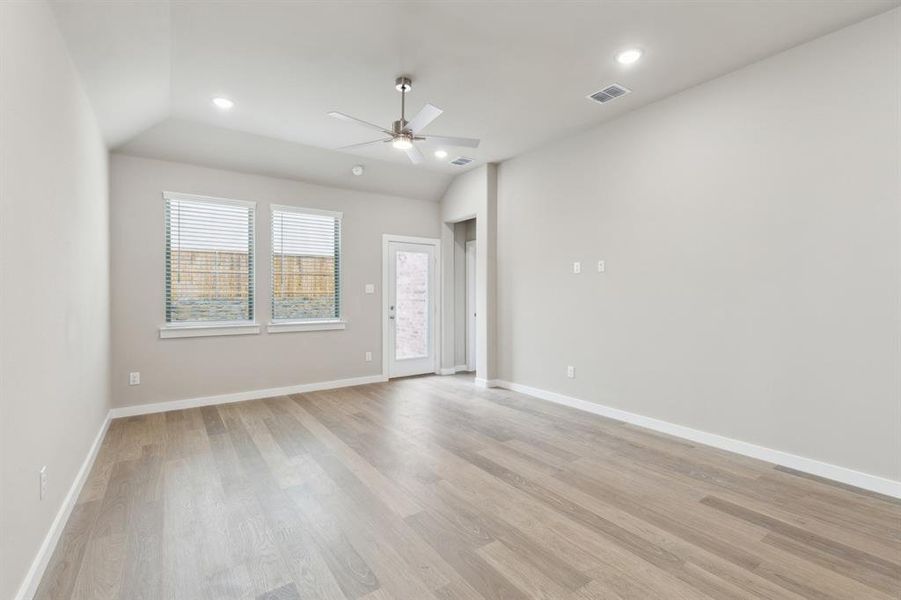 Living room in in the Elm home plan by Trophy Signature Homes – REPRESENTATIVE PHOTO