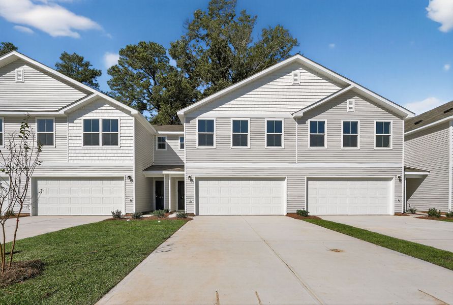 Front exterior of a new home in Graystone Townhomes, Florence, SC, highlighting curb appeal (Image 1).