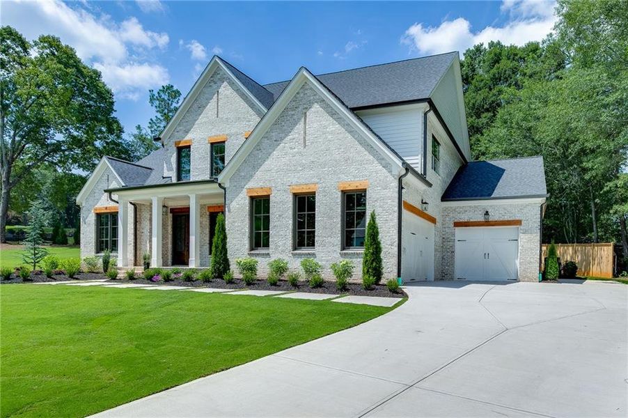 Front exterior of a new home in , Buford, GA, highlighting curb appeal (Image 32).