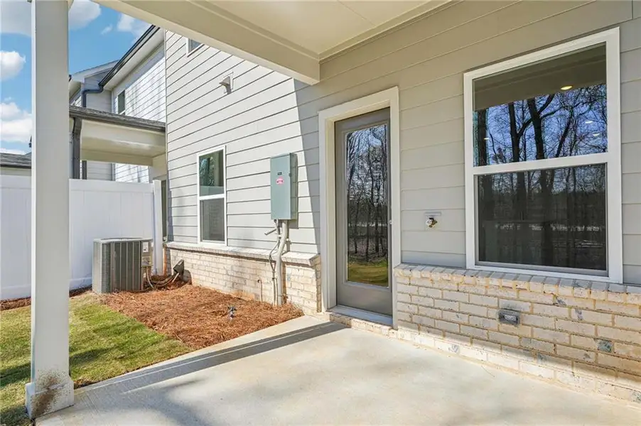 Exterior details and patio area of a home in Eastlyn Crossing, Flowery Branch (Image 16). Exterior details and patio area of a home in Eastlyn Crossing, Flowery Branch (Image 16).
