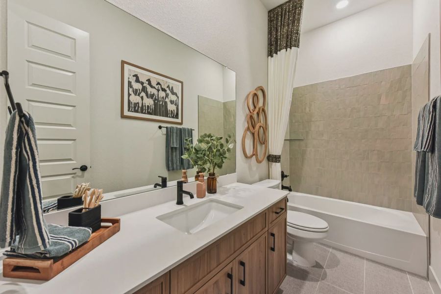 Representative furnished interior of a home built from the Sicily by Chesmar Homes in Lakes of Cane Island, Katy (Image 13).