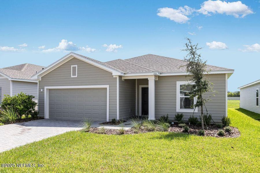 Front exterior of a new home in Coopers Meadow, Jacksonville, FL, highlighting curb appeal (Image 19). Front exterior of a new home in Coopers Meadow, Jacksonville, FL, highlighting curb appeal (Image 19).
