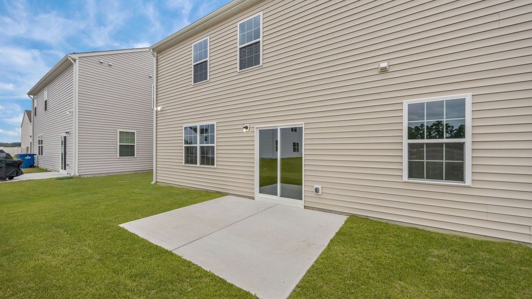 Exterior details and patio area of a home in Ridgewood Farms, Winterville (Image 21).