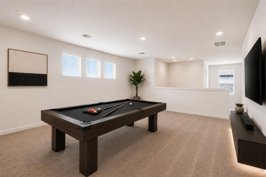 Spacious upstairs game room with an open layout, recessed lighting, carpeted flooring, and flexible space for entertaining, media, play, or additional living area. Virtually staged to illustrate potential room functionality and furniture placement.