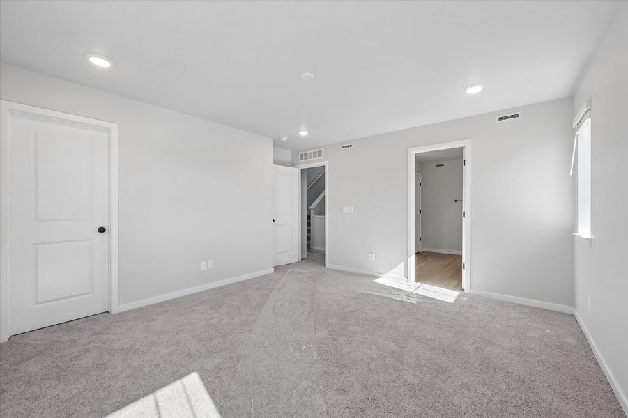 A hallway with white doors.