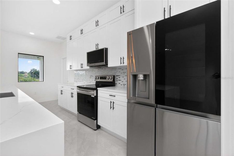 Furnished interior view inside a new home in , Port Charlotte (Image 14).