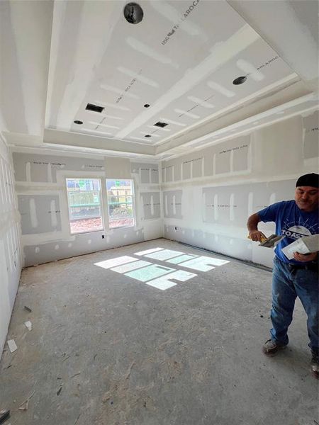 Primary bedroom with tray ceiling