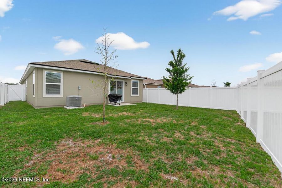 Exterior details and patio area of a home in Cross Creek Express, Green Cove Springs (Image 25).
