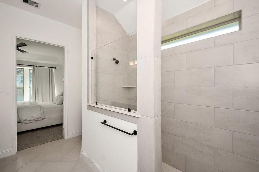 Large primary bathroom with dual sinks and walk-in shower Large primary bathroom with dual sinks and walk-in shower
