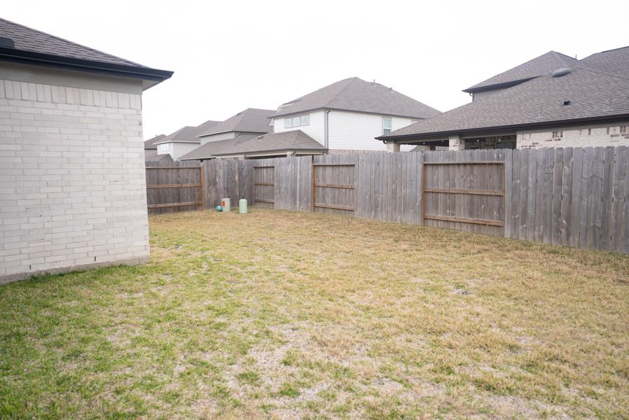 Exterior details and patio area of a home in Sunterra, Katy (Image 28). Exterior details and patio area of a home in Sunterra, Katy (Image 28).