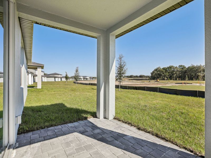 Exterior details and patio area of a home in The Reserve at Hammock Oaks - Signature Series, Lady Lake (Image 3). Exterior details and patio area of a home in The Reserve at Hammock Oaks - Signature Series, Lady Lake (Image 3).