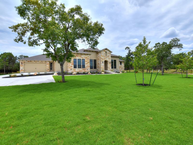 Representative exterior photo of a completed home built from the Avalon by Giddens Homes in Scofield Farms Estates, Georgetown, TX (Image 32).