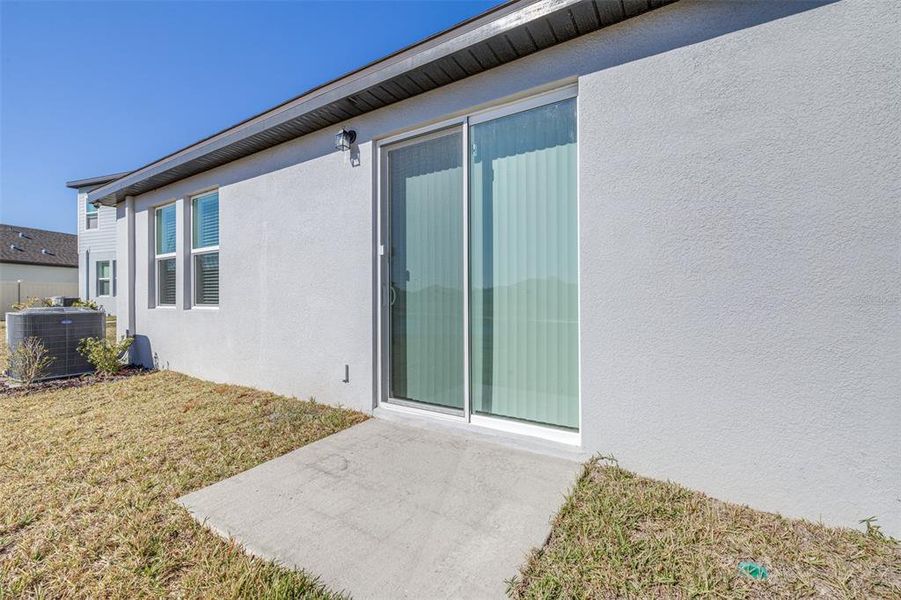 Exterior details and patio area of a home in The Grove at Stuart Crossing - Premier Series, Bartow (Image 3).