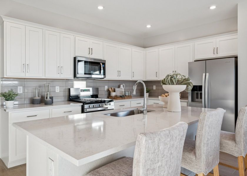 A kitchen with white cabinets. A kitchen with white cabinets.