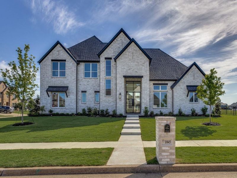 Front exterior of a new home in The Bridges At Preston Crossing, Gunter, TX, highlighting curb appeal (Image 16).