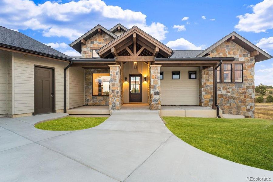 Front exterior of a new home in , Parker, CO, highlighting curb appeal (Image 21).