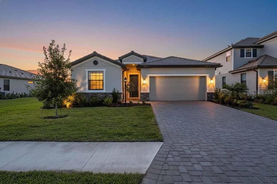 Front exterior of a new home in , Bradenton, FL, highlighting curb appeal (Image 1). Front exterior of a new home in , Bradenton, FL, highlighting curb appeal (Image 1).
