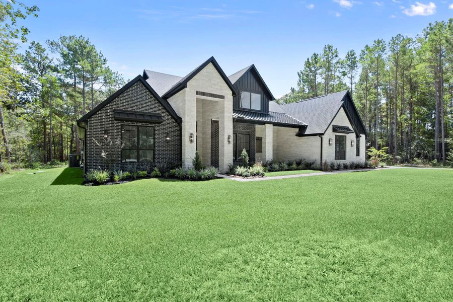 Front exterior of a new home in , Huntsville, TX, highlighting curb appeal (Image 21).