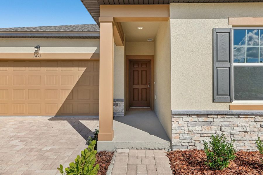 Representative exterior details of a home built from the Moonbeam by Starlight Homes in Hawks Run, Kissimmee (Image 4).