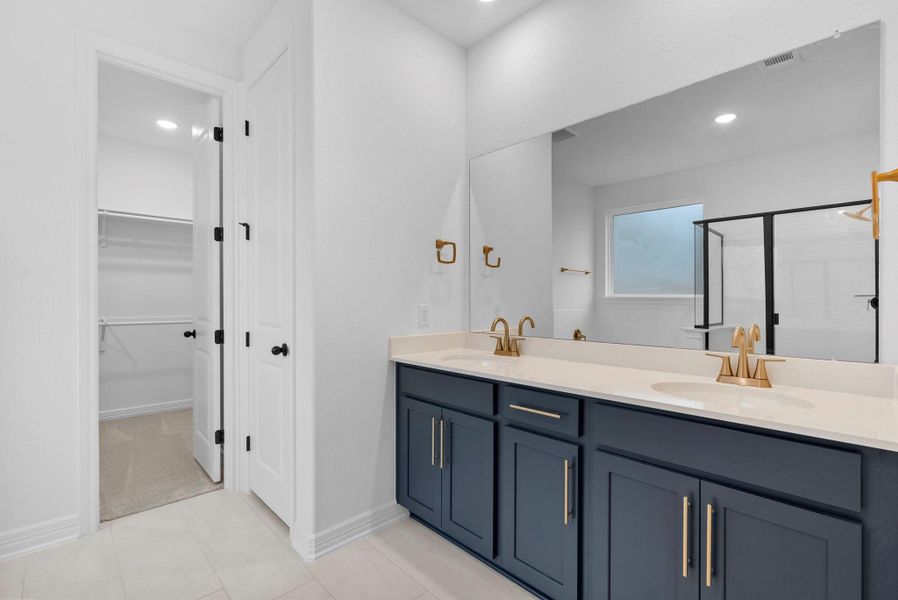 A spa-inspired primary bath pairs crisp finishes with modern contrast for a fresh, polished feel.