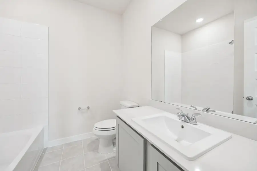 Bathroom in the Claret home plan by Trophy Signature Homes – REPRESENTATIVE PHOTO