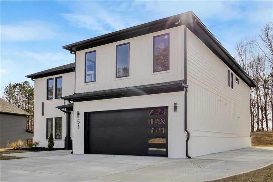 Front exterior of a new home in , Auburn, GA, highlighting curb appeal (Image 24).