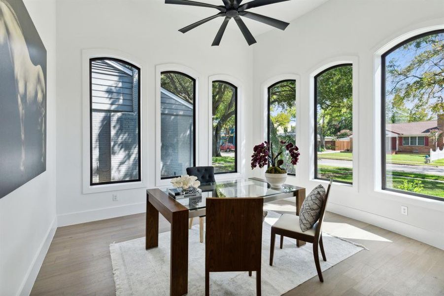 Dining space featuring hardwood / wood-style flooring, a wealth of natural light, and ceiling fan