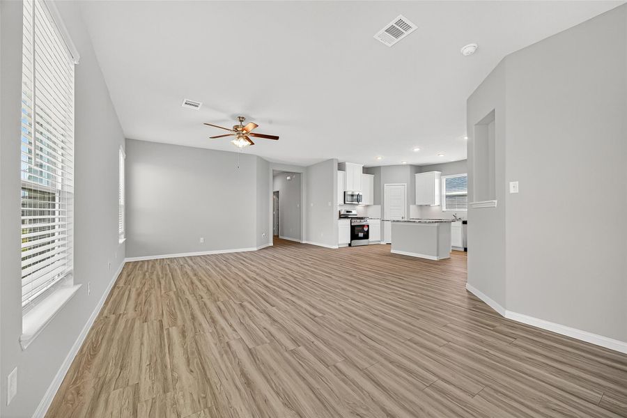 Spacious, unfurnished interior of a new home in Sunterra, Katy (Image 34).
